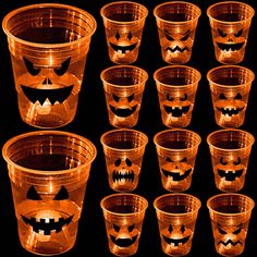 many plastic cups with pumpkin faces on them