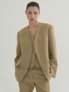 Composition : WOOL 50% POLYESTER 50%Color : beigeCountry of Origin : Republic of Korea Structured Beige Business Outerwear, Elegant Beige Wool Blazer, Tailored Elegant Beige Outerwear, Elegant Khaki Blazer For Office, Elegant Structured Beige Blazer, Structured Beige Outerwear For Formal Occasions, Structured Beige Outerwear For Office, Chic Beige Wool Blazer, Beige Fitted Structured Blazer