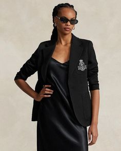 This modern blazer stands out with embellishing details while maintaining timeless style. Featuring a notched lapel, button front closure and long sleeves with buttoned cuffs, it offers versatile layering. An embroidered crest at the chest pocket along with hip and chest patch pockets add fashion-forward flair. Lined in luxurious fabrics, this piece moves effortlessly from day to night. Crafted from a soft blend, it feels as polished as it looks. With its back vent and adaptability for all occas Elegant Black Blazer With Patch Pockets, Luxury Long Sleeve Blazer With Pockets, Luxury Blazer With Patch Pockets For Work, Ralph Lauren Outerwear With Welt Pockets And Lapel Collar, Ralph Lauren Outerwear With Lapel Collar And Welt Pockets, Fitted Ralph Lauren Outerwear With Welt Pockets, Luxury Button-up Blazer With Pockets, Ralph Lauren Single-breasted Long Sleeve Blazer, Casual Ralph Lauren Blazer With Notch Lapel