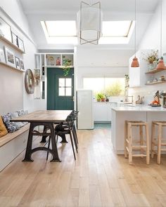 the kitchen is clean and ready to be used as a dining room or breakfast nook