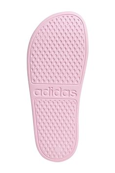 These kids' shower-friendly sandals have a one-piece moulded EVA upper and a plush Cloudfoam footbed that's soft and comfortable on tired little feet. Iconic 3-Stripes show off adidas DNA. . Open toe. 3-stripes print. Slip-on. Molded cushioned footbed. Imported Manmade upper and sole Pink Non-slip Synthetic Slippers, Pink Synthetic Slide Slippers, Pink Non-slip Slide Slippers, Comfortable Pink Synthetic Slides, Comfortable Pink Slides, Pink Cushioned Synthetic Slides, Comfortable Non-slip Pink Flip Flops, Pink Cushioned Synthetic Slippers, Pink Cushioned Slippers With Synthetic Material