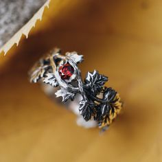 DETALIS Ring is made of high-quality 925 sterling silver and red cubic zirconia. The width of the ring is 9 mm. Finish - oxidized. This exquisite ring captures the essence of autumn with its intricate design of delicate maple leaves and a rich red stone. This silver ring is not just a piece of jewelry; it's a wearable work of art that celebrates the beauty of nature during the autumn season, making it the perfect accessory for those who cherish the changing leaves and the crisp, cool air of this Forest Ring, Forest Jewelry, Silver Leaf Ring, Jewelry Nature, Nature Inspired Rings, Changing Leaves, Nature Ring, Leaf Ring, Maple Leaves