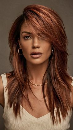 Warm Chestnut Copper is a rich and earthy shade that combines the warmth of copper with the deep, natural tones of chestnut. This color is ideal for those with medium to dark skin tones and looks stunning on long, layered hair. The warm, reddish-brown tones add depth and dimension, making it a versatile and flattering choice. Copper Hair With Lowlights Dark Auburn, Reddish Dark Brown Hair, Red Hair On Brown Hair, Red Brown Hair Color Auburn, Copper Long Bob, 2 Tone Hair Color Ideas, Hair Colour For Fair Skin Tone, Cool Red Hair Color, Copper Hair Makeup