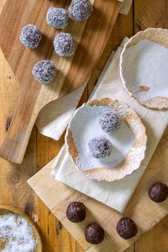 there are several desserts on the wooden table