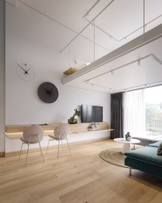 a living room filled with furniture and a flat screen tv on top of a wooden floor