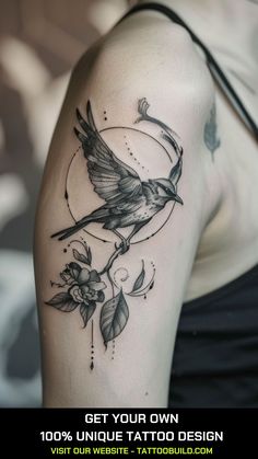 a woman's arm with a bird on it and flowers around the arm tattoo design