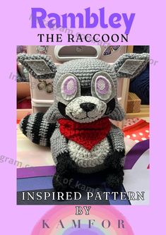 a crocheted raccoon sitting on top of a table with the title ramley the raccoon