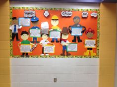 the bulletin board is decorated with paper cutouts