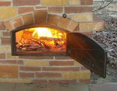 a brick oven with fire burning in it