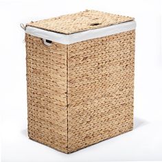 a large woven laundry basket with white lid