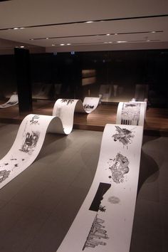 several rolls of toilet paper on display in a museum