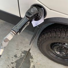 an electric vehicle is plugged in to the charger