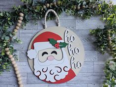 a wooden sign with a santa clause on it