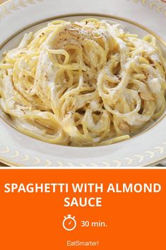 spaghetti with sauce on a plate in front of an orange and white background that reads spaghetti mit mandelsofe