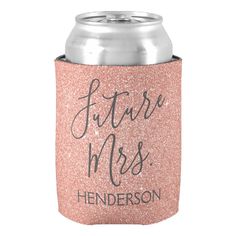 a pink glitter can cooler with the words just married on it, and an inscription that reads