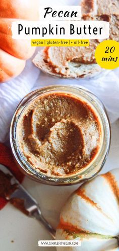 pumpkin butter in a glass jar next to sliced pumpkins and other food on a plate