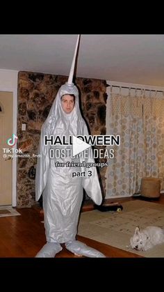 a man dressed as a ghost in a living room