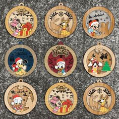 mickey mouse christmas ornament collection on wooden ornaments with disney characters in the background