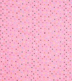 a pink background with multicolored polka dots