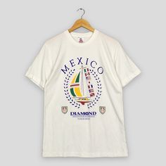 Vintage Mexico Diamond Resorts White Tshirt Medium Playacar Mexico Resorts Tourism Shirt Yacht Sailing Gear Mexico Graphics Tee Size M Good Used Condition. Have minor stains, REFER PICTURE. Size (On Tag) : Size M **To make sure if it FITS YOU, refer at the exact measurements. Size Measurement (All measurements were taken lying flat) : Width [armpit to armpit] : 20 inches / 51 cm Length [shoulder to end of garment] : 28 inches / 71 cm THIS IS USED CLOTHING! PLEASE DON`T EXPECTED IT TO BE LIKE NEW Playacar Mexico, Yacht Sailing, Graphics Tee, Sailing Gear, Mexico Resorts, Vintage Mexico, Used Clothing, Dhl Express, White Tshirt