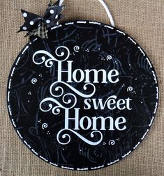 a black and white sign that says home sweet home