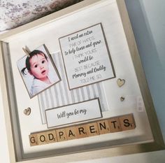 a frame with some pictures on it and words written in scrabbles that spell out the word godparrents