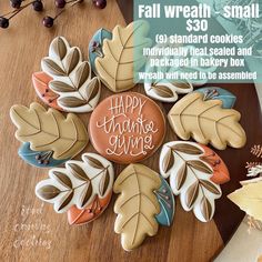 a cookie decorated with leaves and the words happy thanksgiving giving