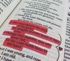 an open bible with red marker on it