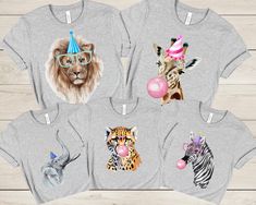 four t - shirts with animals on them and one has a party hat, the other has a balloon