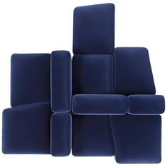 the blue couch is stacked up and ready to be used as a seating area for someone's living room