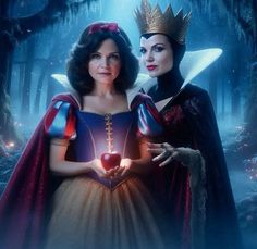 two women dressed as snow white and evil queen in the woods, one holding a heart