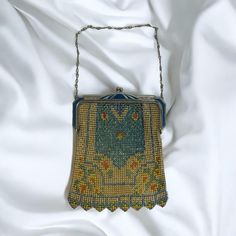 Absolutely gorgeous Antique 1920s WHITING & DAVIS 'BEADLITE' Mesh Evening Bag. THIS IS BRAND NEW IN THE ORIGINAL BOX! This is a true collectors item. It has not once been used and you can for sure tell. It is PRISTINE. No wear to the metal, the beads, the colors; NOTHING It has a gorgeous kiss lock closure.  Measures - 6.5" Height x 5" Length and 5" Chain Drop Welcome to MyEZVintage! Thank you for stopping by! Enjoy looking and let us know if you need help with anything!  Pics are part of our description. Please view the ENTIRE listing carefully as we don't offer returns. If you have any questions, please ask us BEFORE purchasing. We're happy to answer you. We videotape all items being packaged and may affix a tamper-proof tag to cut before first wearing/using.  Located at MyStyle Boutique Vintage Rectangular Bags For Vintage Events, Vintage Rectangular Bags For Events, Handmade Victorian Rectangular Evening Bag, Vintage Rectangular Evening Bag, Vintage Evening Bag For Vintage Events, Victorian Style Rectangular Evening Bag, Handmade Vintage Evening Bag For Vintage Events, Vintage Rectangular Wedding Bags, Handmade Retro Rectangular Evening Bag