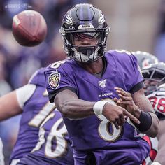 a football player throwing a ball during a game