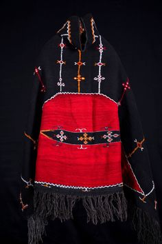 "A rare and authentic Berber shepherd's hooded gray cape or shawl (salham) that ranks among the most magnificent weavings in Morocco. Made by the Ait Ouaouzguite tribe, the akhnif has two major design sections: the first is the black plainwoven field decorated with Berber talismanic tattoos and symbols. the back of this cape comes with fabulous symbol , 'half moon' or eye as protection against the evil eye. The motif in the centre is that of a lizard, which with its sharp tongue pierces evil. Ha Berber Clothing, Black Hooded Cape, Sharp Tongue, Hooded Cape, Vintage Clothing Men, Clothing Vintage, Clothing Men, Clothing Design, Vintage Costumes