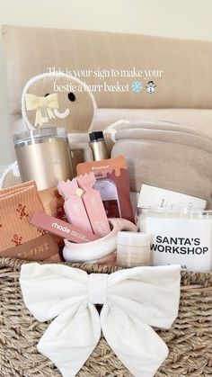 a basket filled with personal care items on top of a bed next to a pillow