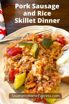 pork sausage and rice skillet dinner on a white plate with a fork next to it