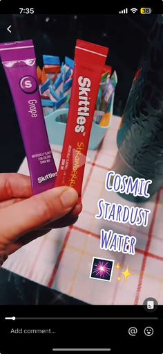 someone holding three tubes of toothpaste in their hand with the caption cosmic stardust water