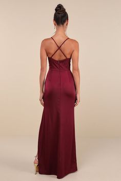 the back of a woman wearing a burgundy gown