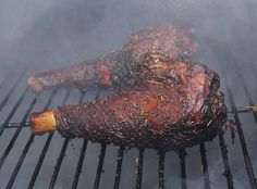 the meat is being cooked on the grill