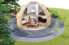 the inside of a round wooden structure with lots of furniture and decor on top of it