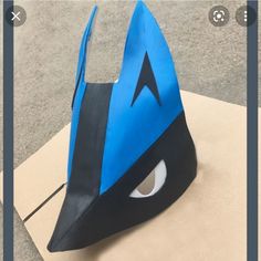 a paper bag with a blue mask on it