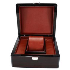 Single-Slot Lacquered Wood Watch Case with Velvet Interior This simple yet elegant watch display is perfect for storing, protecting, and showcasing your watch. Lift the lid of this dark brown lacquered wooden box with a red leatherette interior to admire your timepiece. Dimensions: Approximately 17 x 15 x 10 cm Color: Dark brown for a cozy and welcoming look Noble material: Wooden exterior Softness: Red leatherette interior Elegant Watch, Bar Accessories Decor, Velvet Interior, Luggage Organization, Watch Display, Lacquered Wood, Velvet Interiors, Wooden Watch, Unique Bags