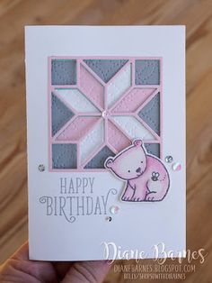 a hand holding up a card with a bear on it's face and the words happy birthday