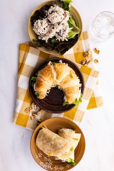 two plates filled with food on top of a table