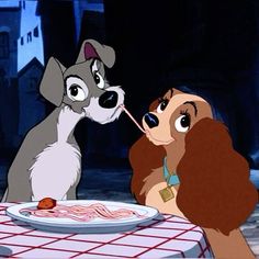 lady and the tramp talking to each other in front of a plate of food