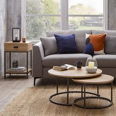 a living room scene with focus on the couch and coffee table in the center area