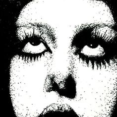 a black and white photo of a woman's face with large lashes on it