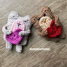 two crocheted stuffed animals sitting next to each other