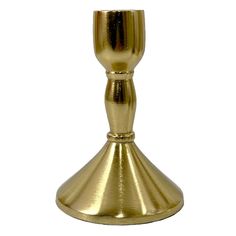 a gold colored candle holder on a white background