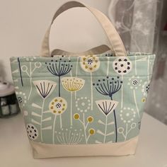 a blue and white bag sitting on top of a table